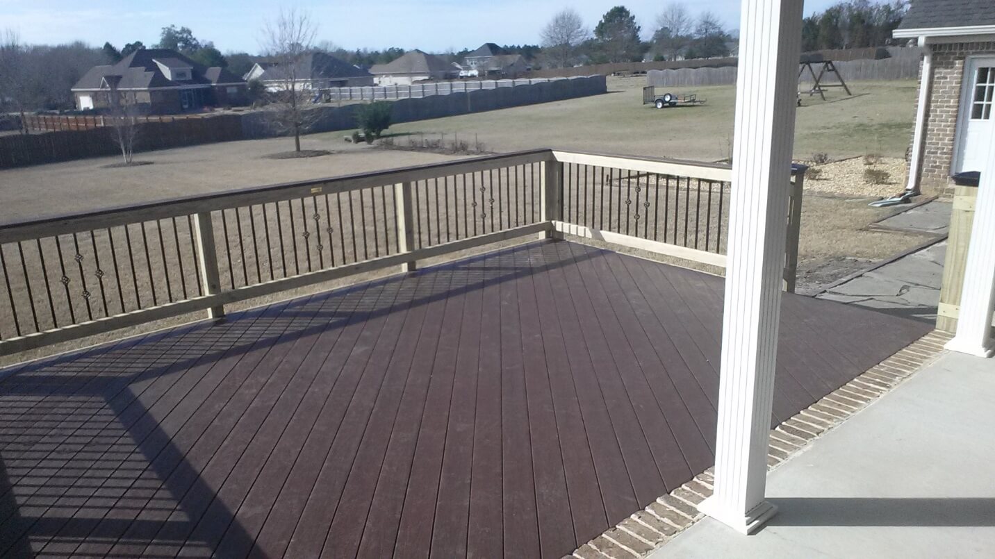 Custom low maintenance deck with backyard view