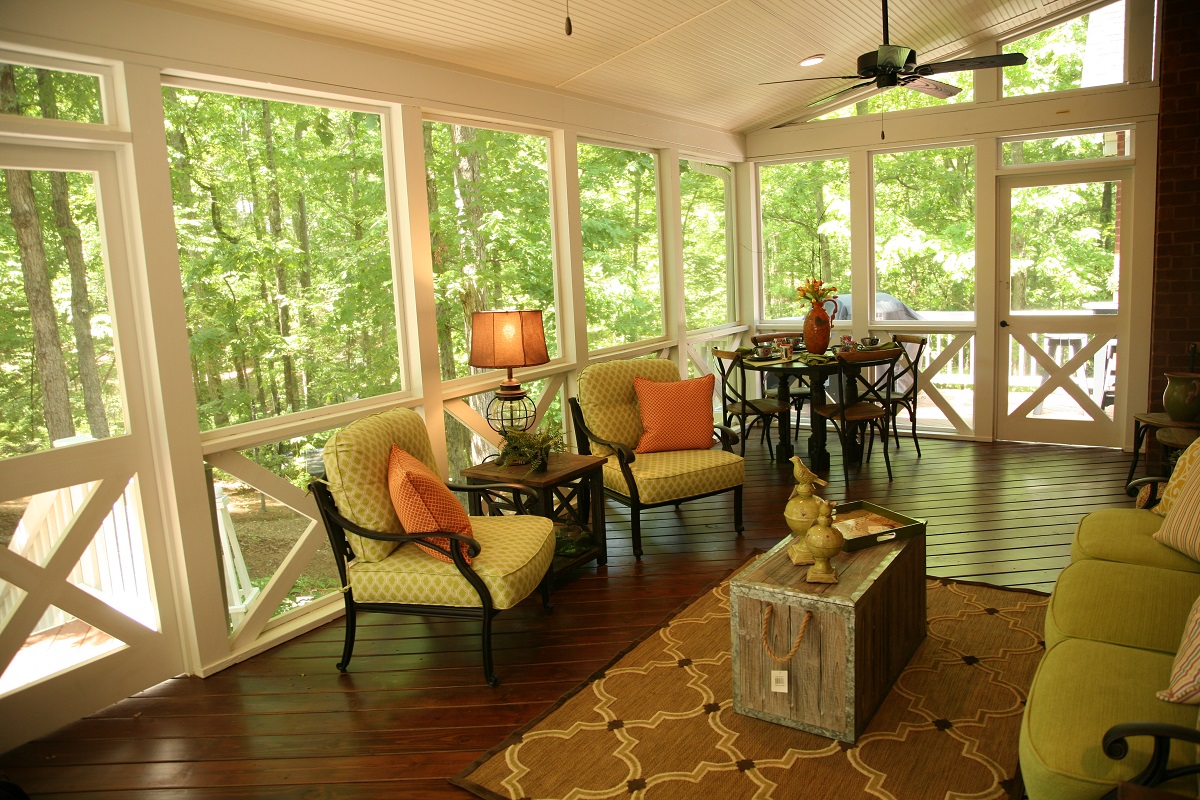 screened in porch with furniture