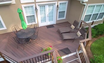 deck with lounge chairs and table