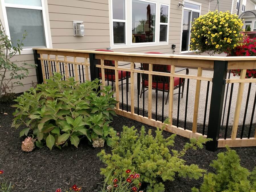 deck with railings and plants