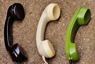 Black, white and yellow green phone receiver