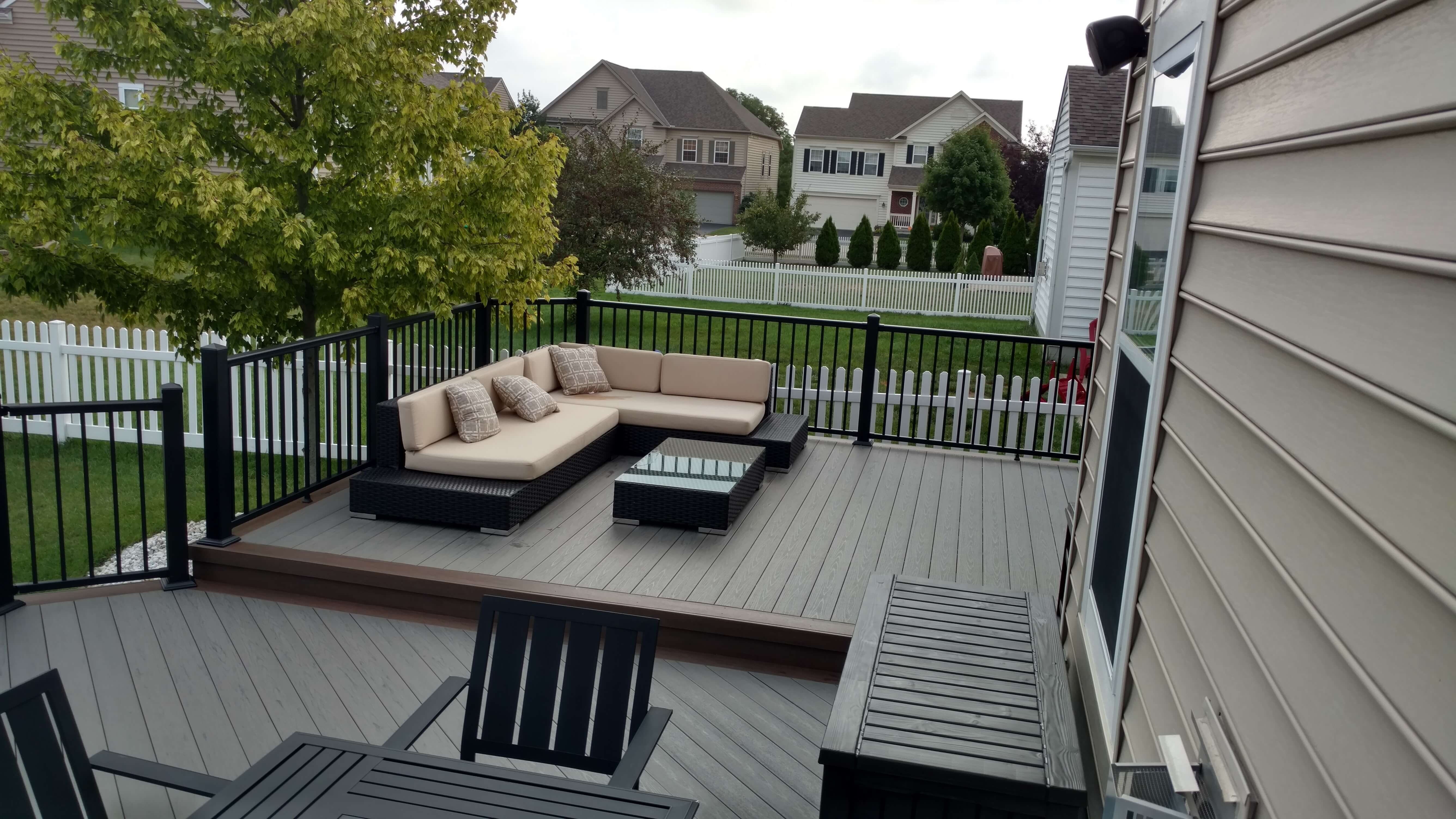 Cozy seating area on custom backyard deck