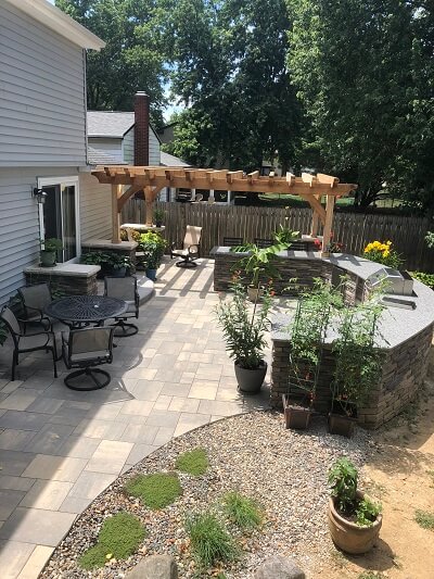 Custom patio with pergola and outdoor kitchen