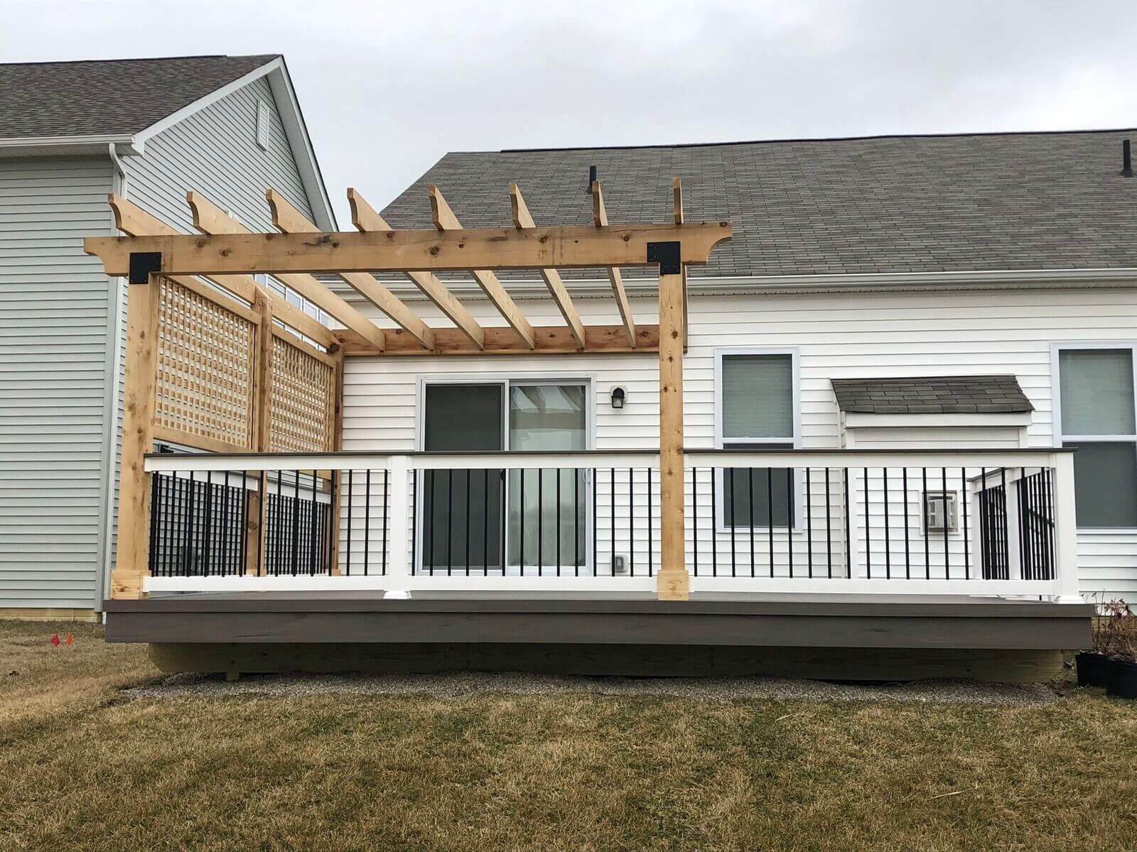 Custom backyard deck with wood pergola