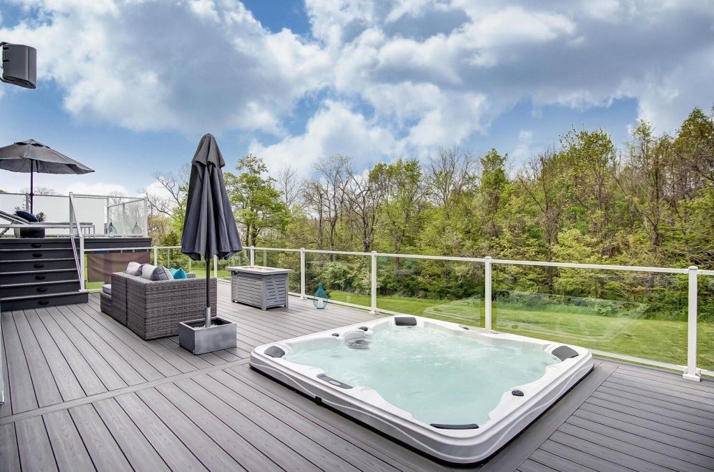 deck with a hot tub