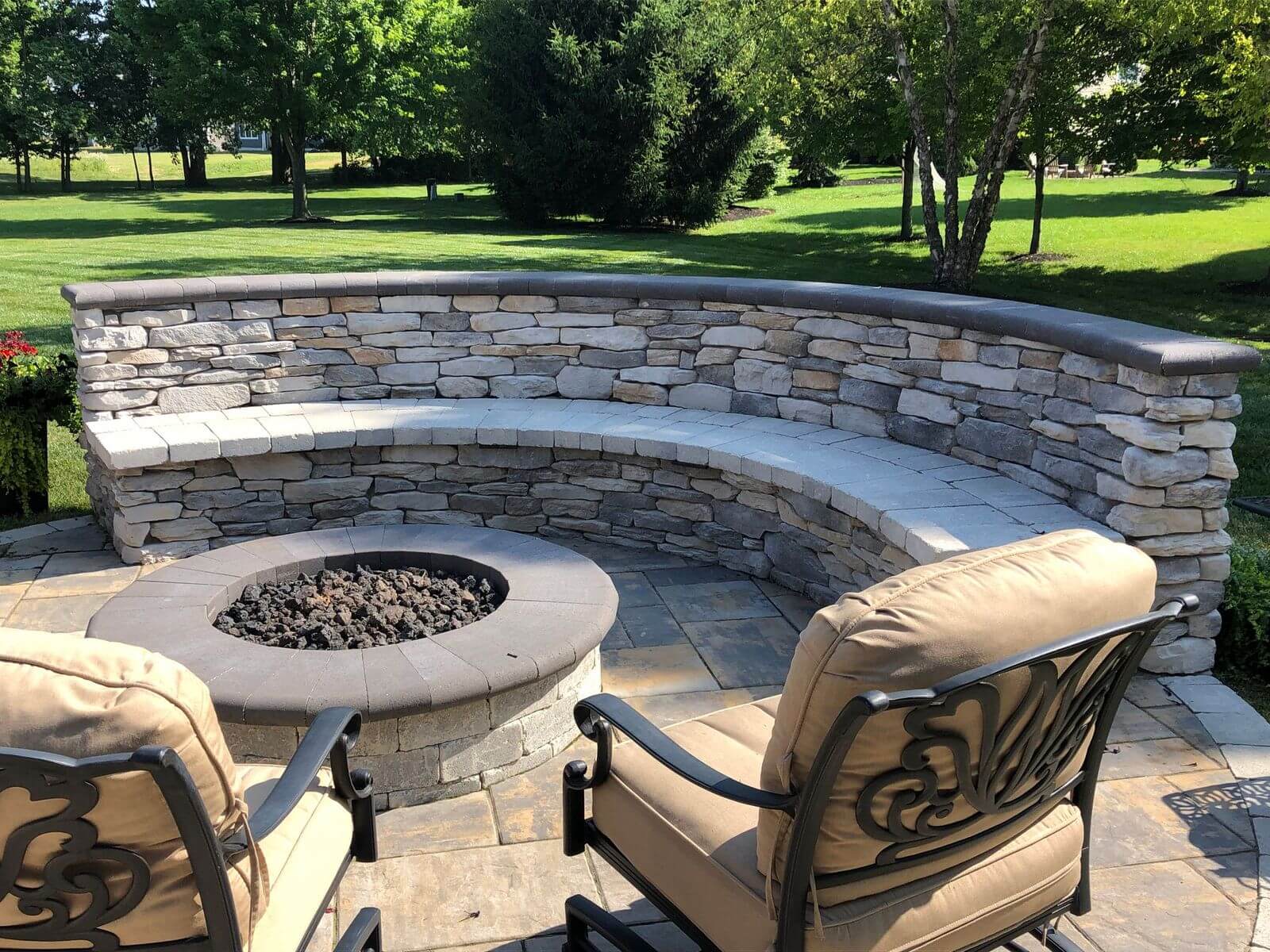 Patio with fire pit and seating wall