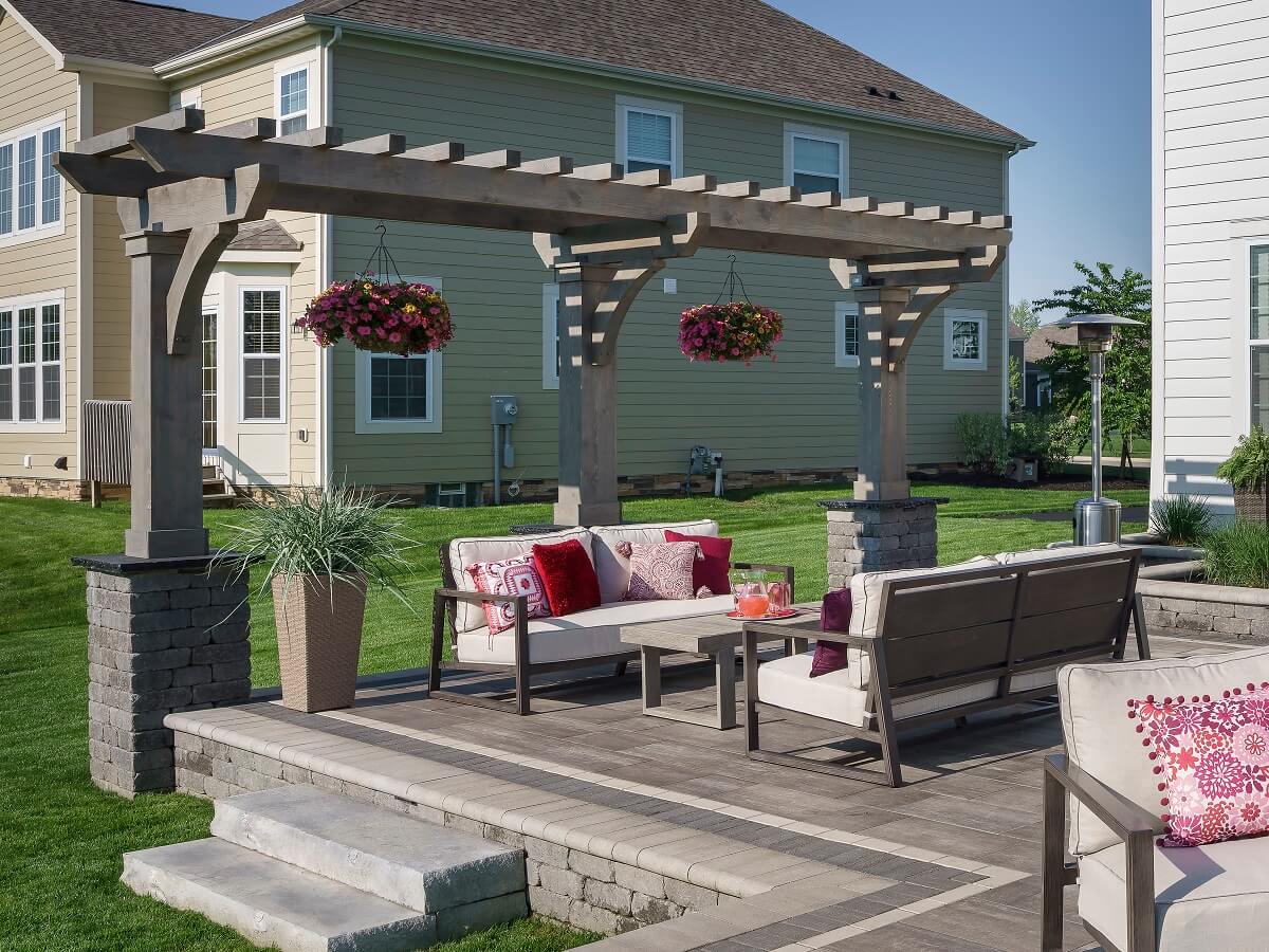 Pergola with hanging flowers on patio
