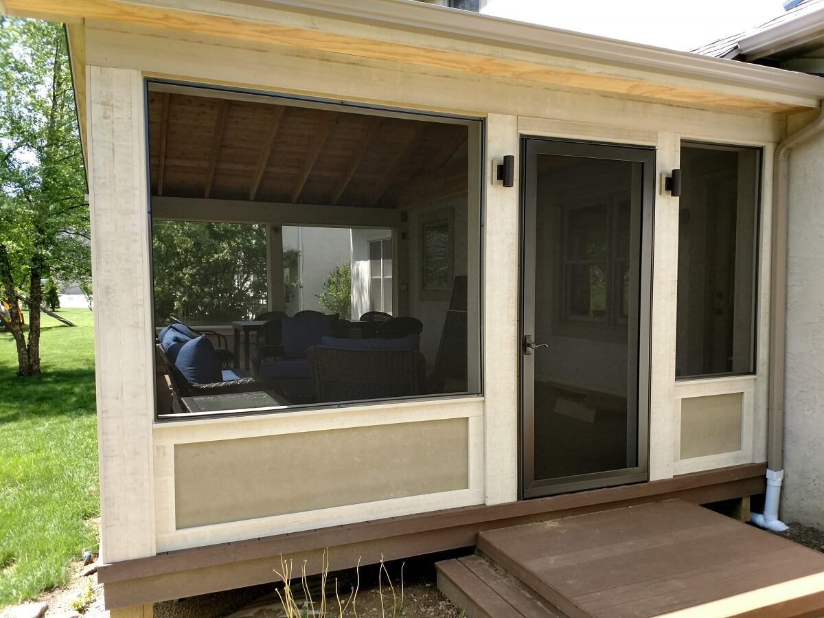 Side view of custom backyard screened porch