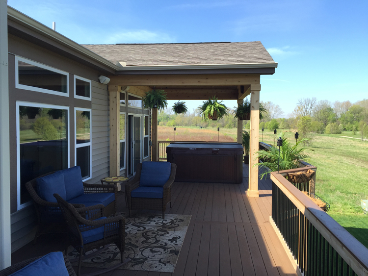 Deck and open porch with hot tub in Columbus.