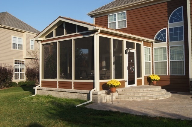 Screened porch with patio features within porch.