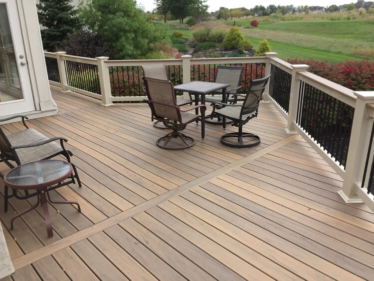 wood deck with railings and chairs