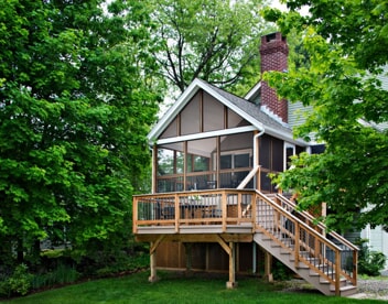 screened porch with deck and staircase