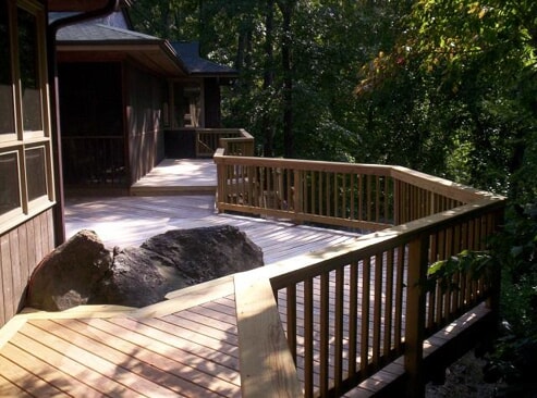 large outdoor wood deck with rock features
