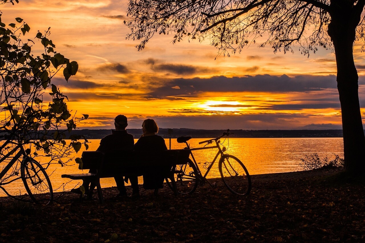 Couple sitting by a lake