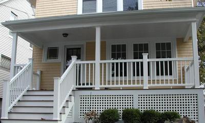 Custom front porch with white railing