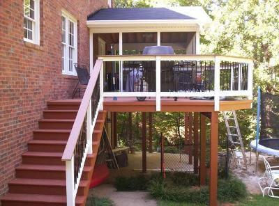 Elevated screened porch and deck with outdoor kitchen
