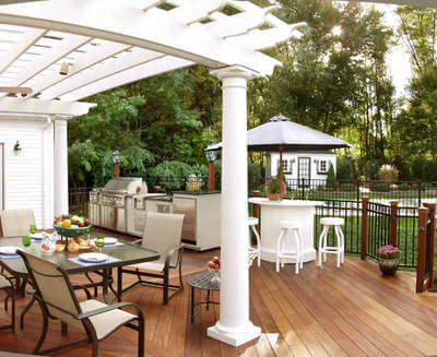 Custom backyard deck with pergola and outdoor kitchen