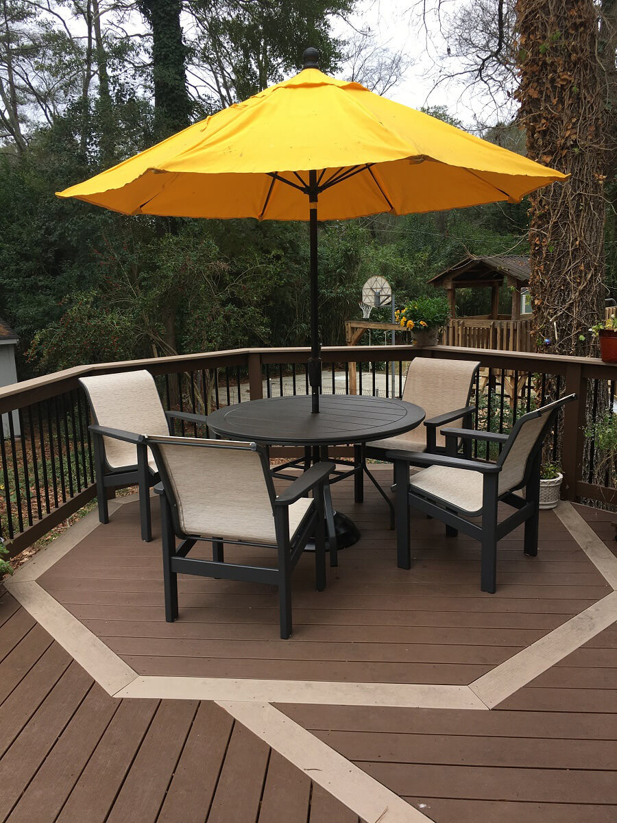 Yellow umbrella on seating area on deck