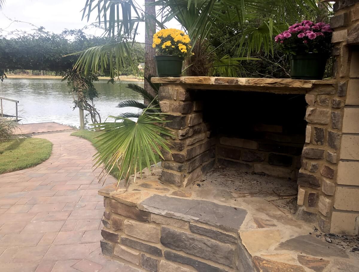 Outdoor fireplace fire box and lake view