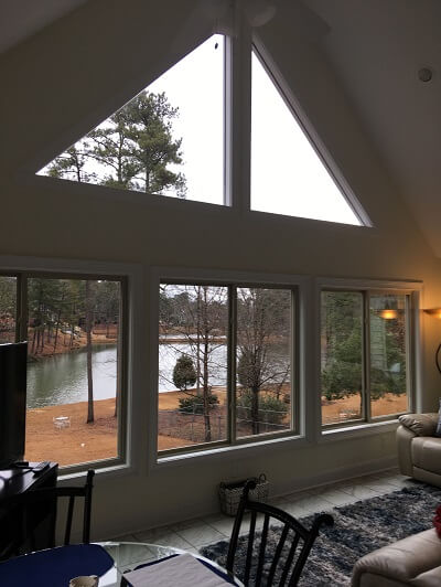 Interior view of custom sunroom with private pond view