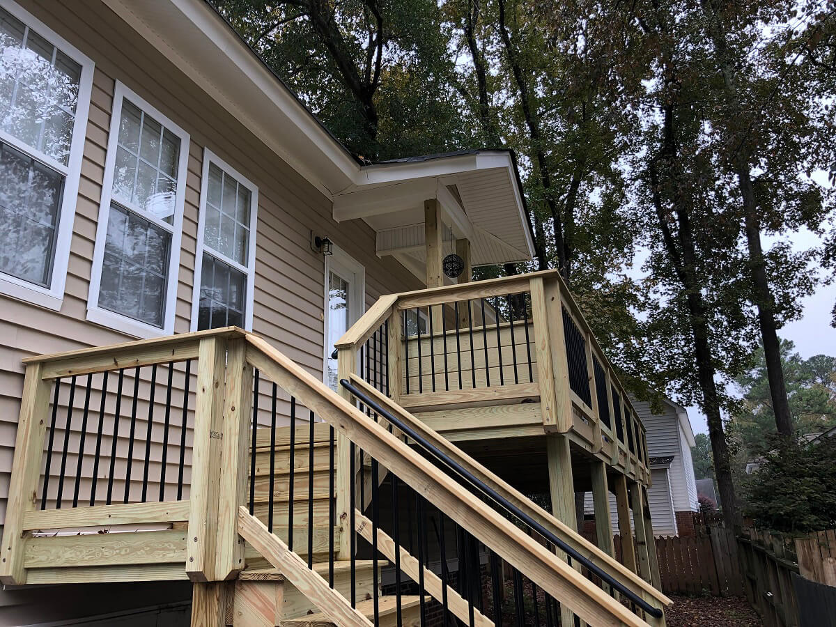 Porch expansion with custom railing