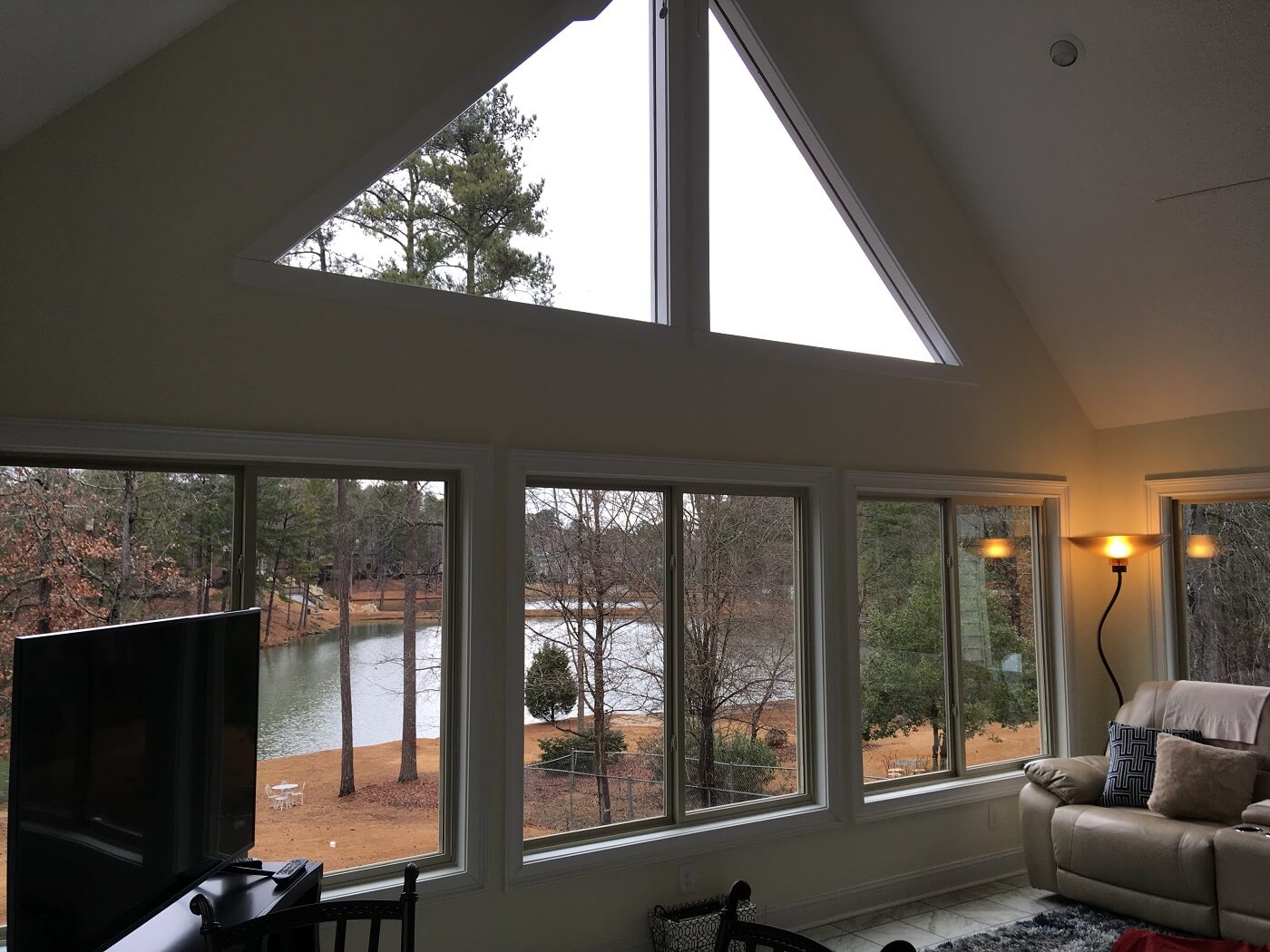 Interior of sunroom with private pond view