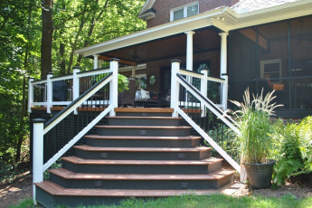 A grand entrance from the backyard onto this deck and covered porch combo in Governors Grant Lexington SC