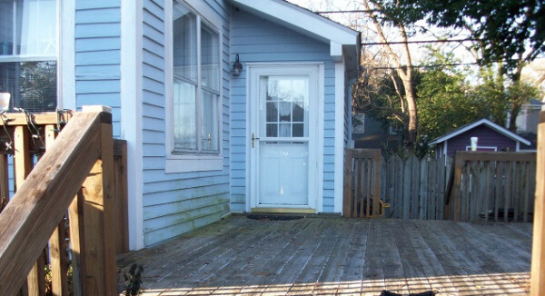 Before: this image shows the existing deck before we converted a portion into a lovely screened porch.