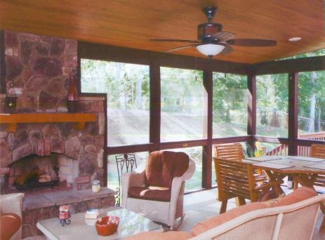 Columbia, SC three season room with rustic beadboard ceiling, ample dining and seating areas complete with a cozy outdoor fireplace.