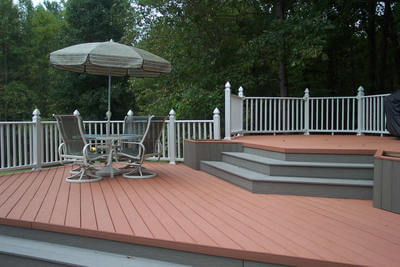Composite deck accented w gray trim & white rail