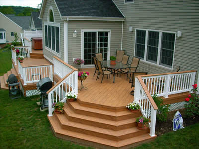 Composite deck with spa deck by Archadeck
