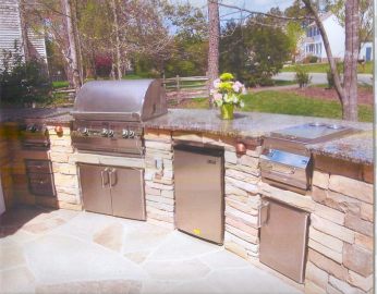 Rustic inspired outdoor kitchen with stone and granite combination.