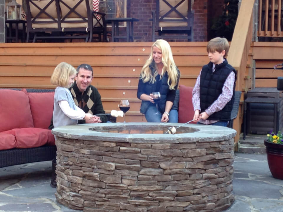 Family by a fire pit