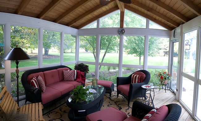 sun porch with black and red furniture