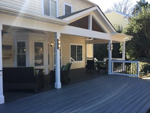covered porch with an extended deck