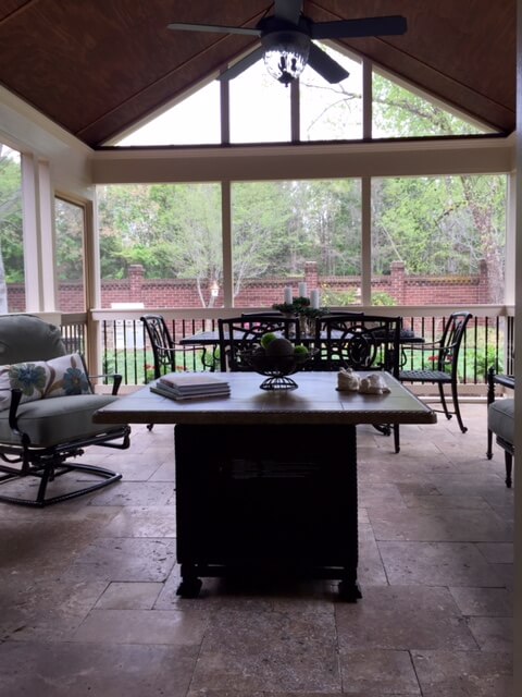 screened porch with travertine tile