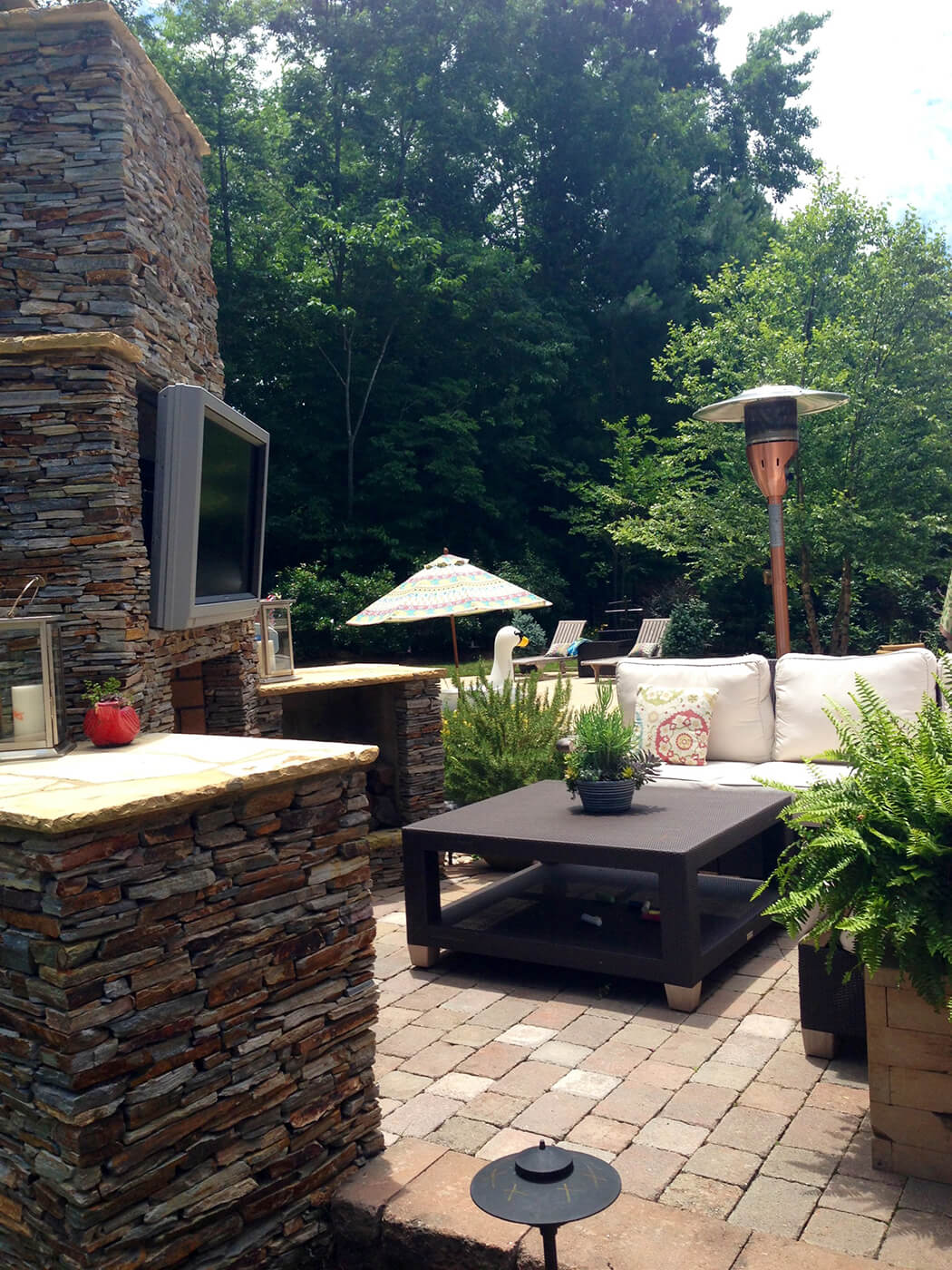 patio with outdoor fireplace