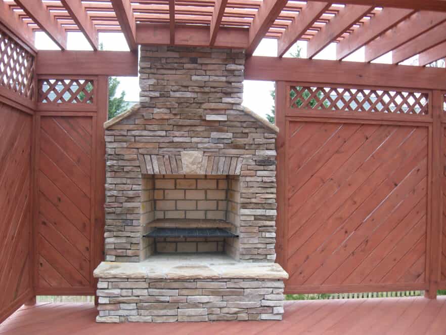 Deck with pergola and outdoor fireplace