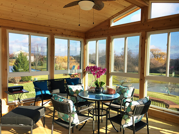 sunroom with wooden interior and furniture