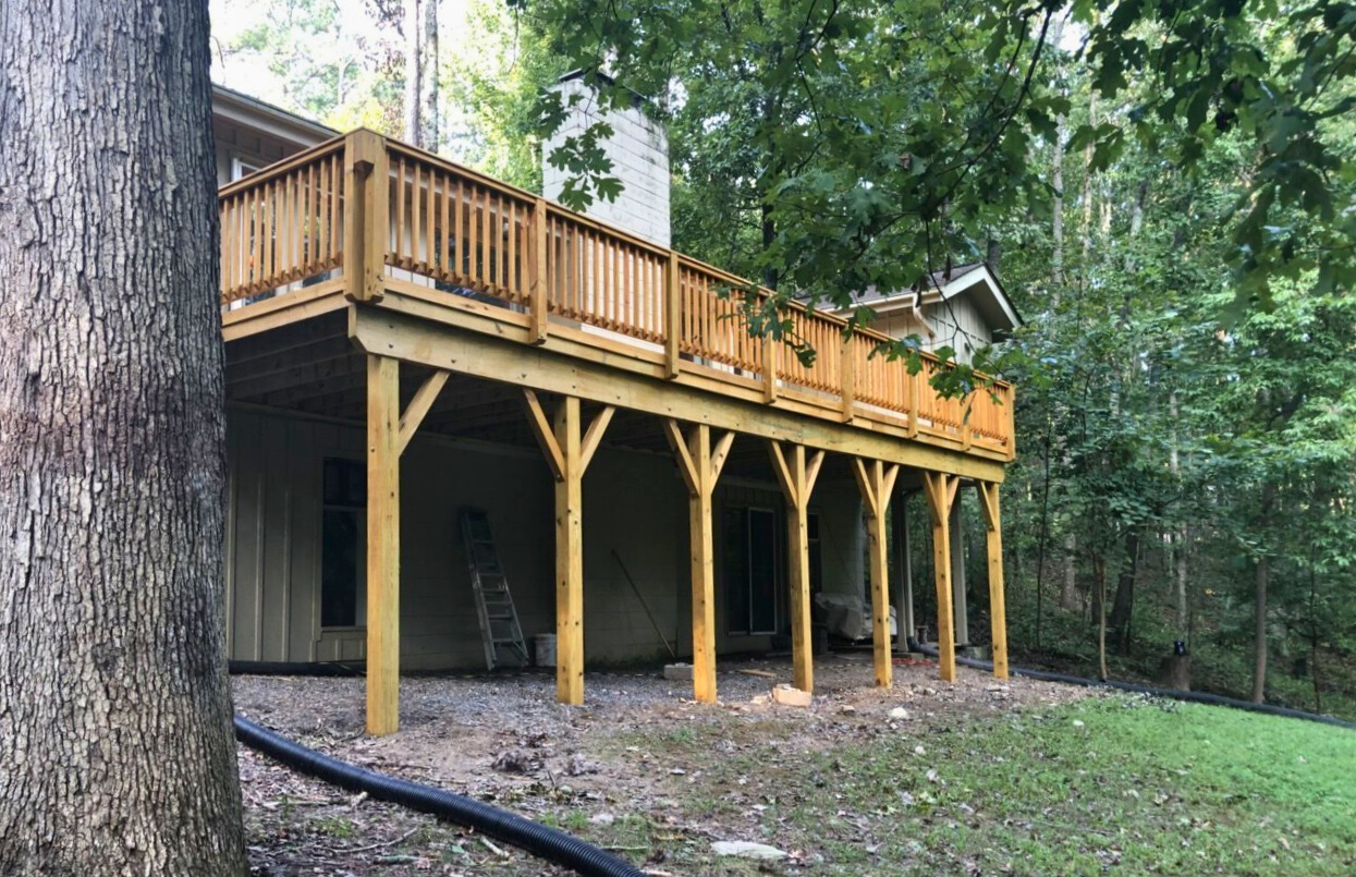 Custom two-story wood deck construction by Archadeck, a leading deck builder in Waxhaw, NC.