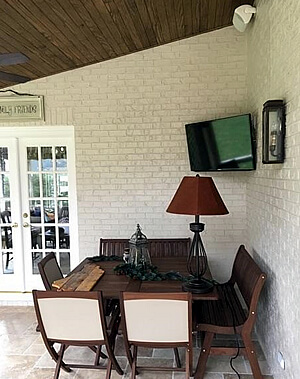 screened porch with TV