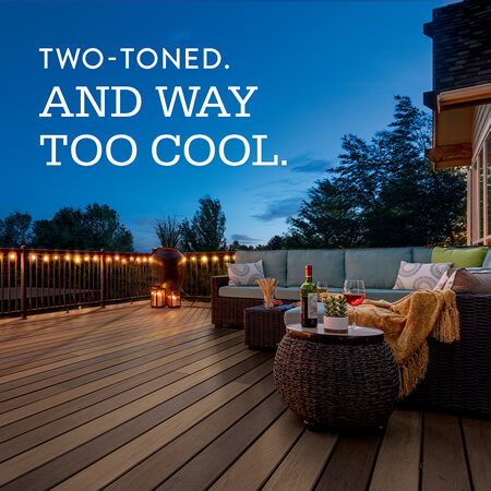 TimberTech dual tone deck at night with lights, text says - Two-Toned. And Way Too Cool.