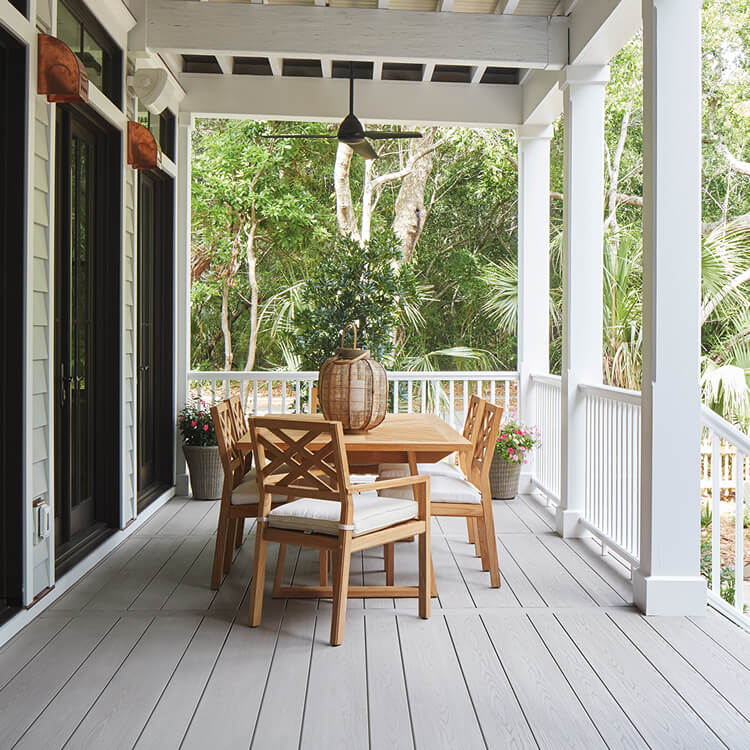 TimberTech porch with white railing and details and wood table