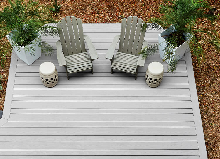 overhead view of TimberTech wide width deck with plants on chairs on it