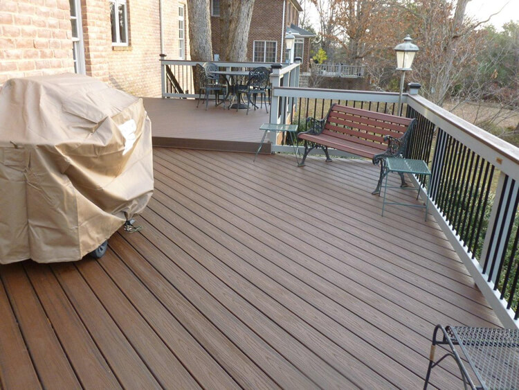 deck with covered barbecue and outdoor furniture