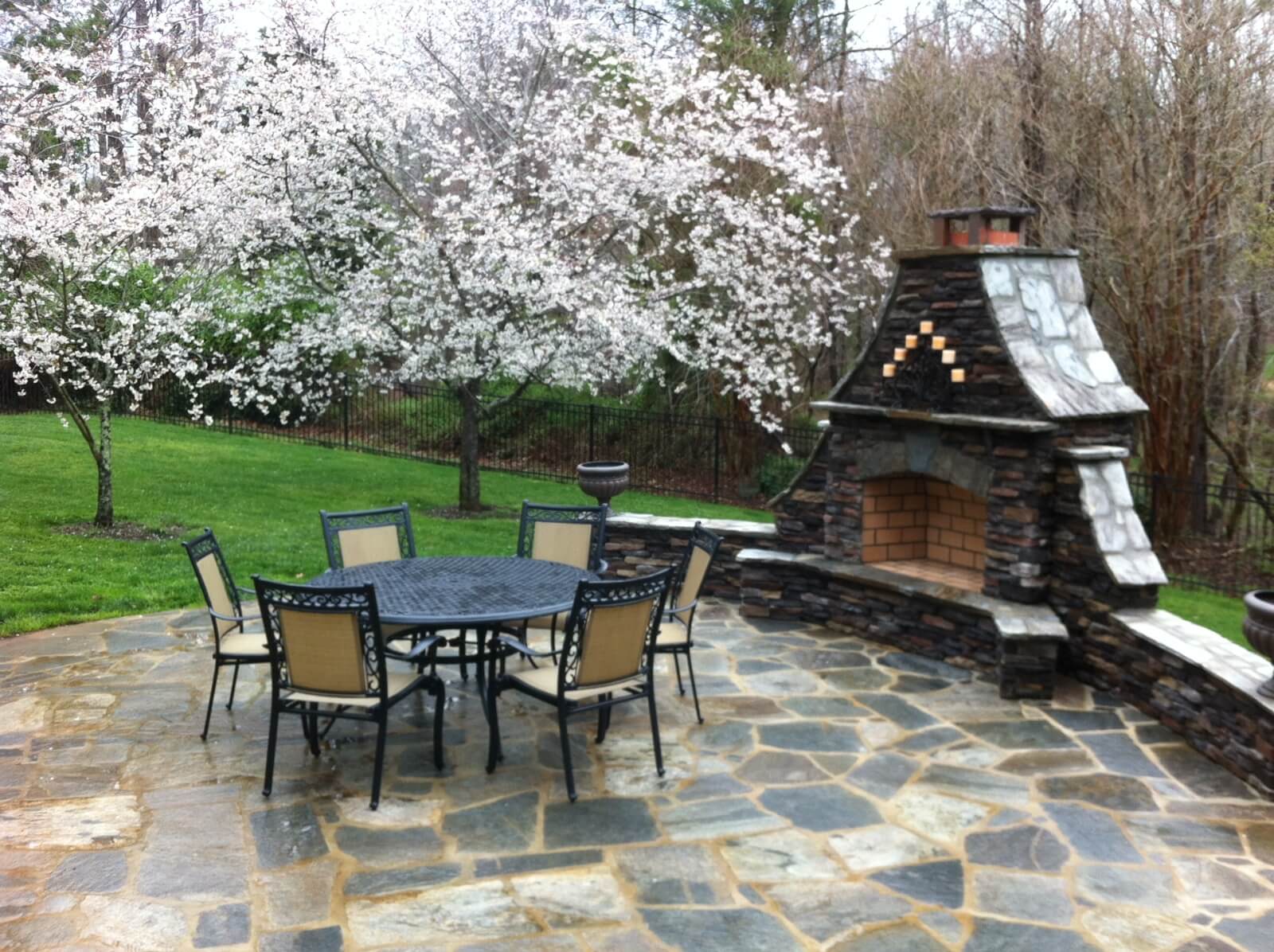 Backyard patio with outdoor fireplace