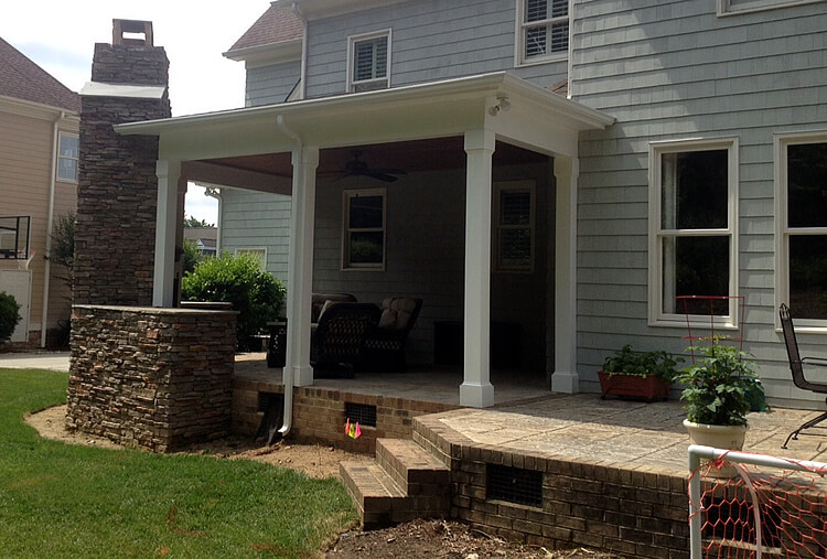 Custom porch and patio with outdoor fireplace