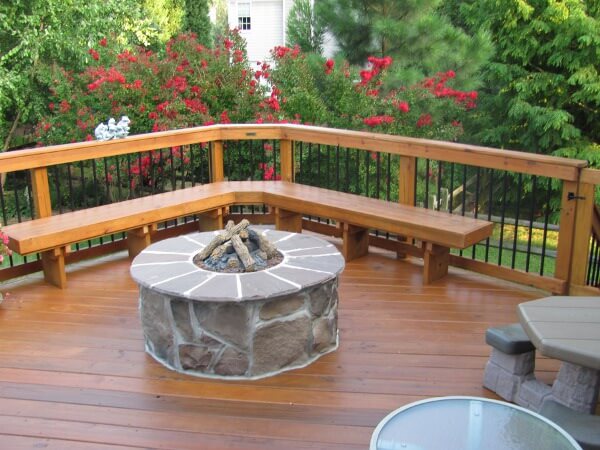 Custom deck with floating bench and stone fire pit