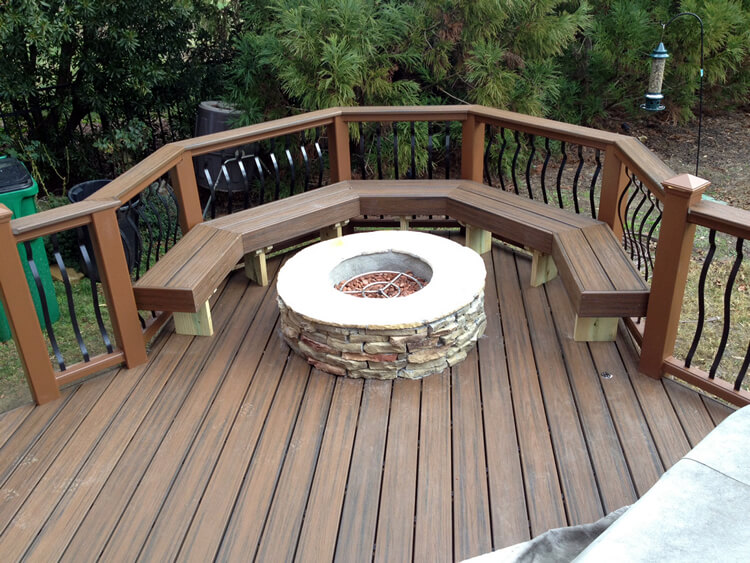 Custom deck with stone fire pit and floating bench