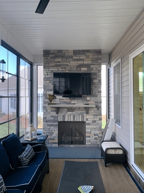 screened porch with fireplace